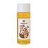 A small bottle on which a large drop of jojoba oil can be seen.